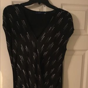 Black with white and gray marks shirt.